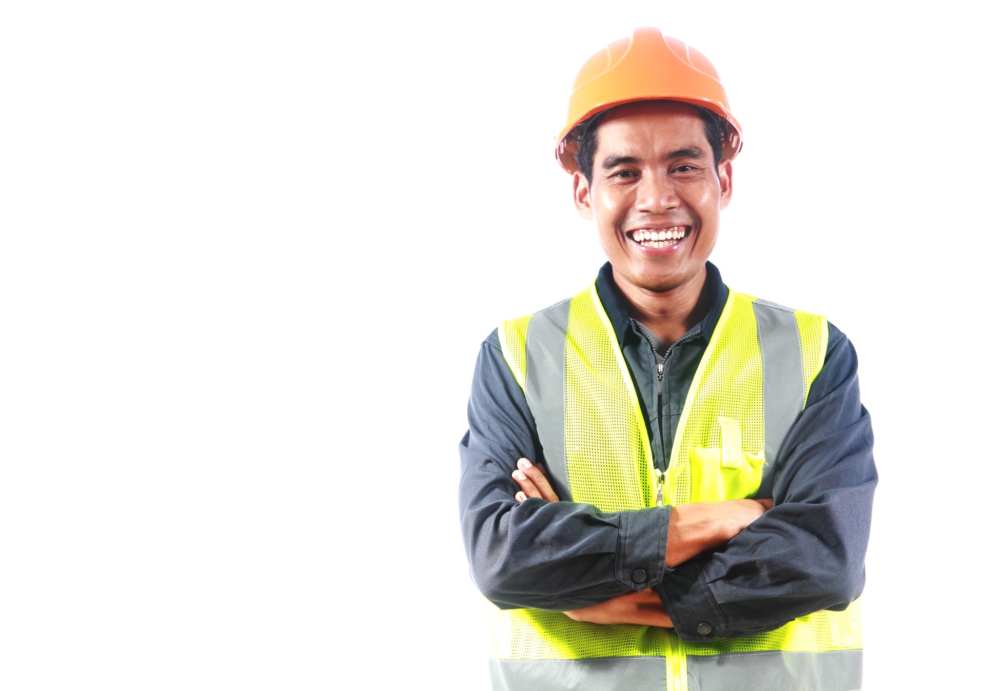 Male engineer in neon safety vest posing on white background